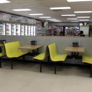Eating tables inside the Wee Vill Market.