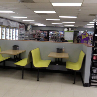 Eating tables inside the Wee Vill Market.