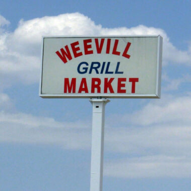 Store signage for Wee Vill Grill Maket.